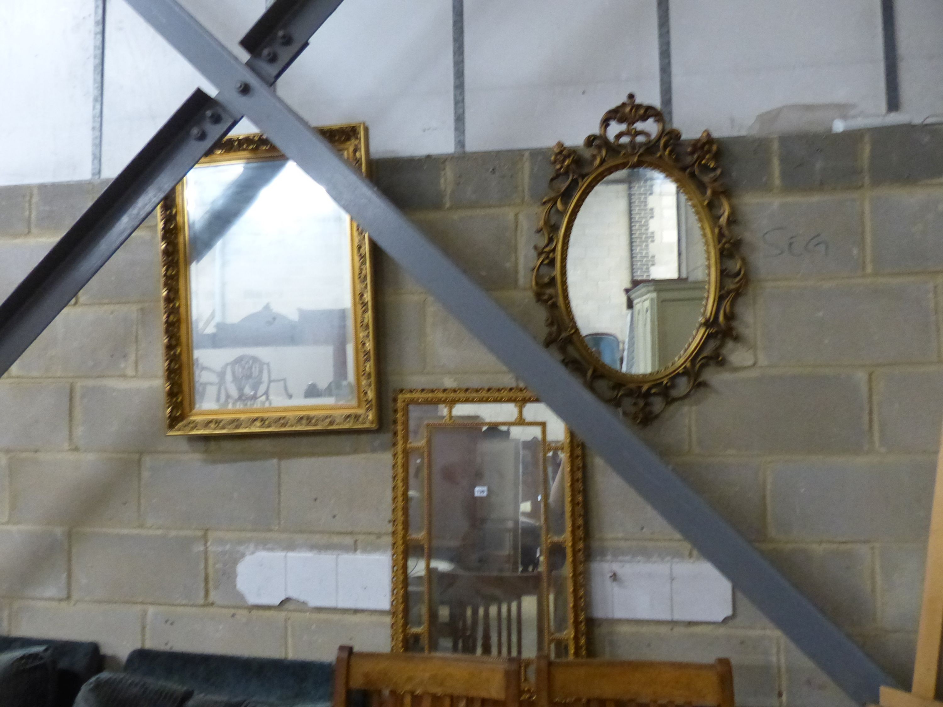 Three reproduction gilt framed wall mirrors, largest W.63cm H.85cm